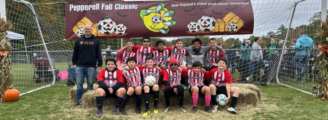 Tyngsboro team posing in front of goal during Pepperell Fall Classic tournament