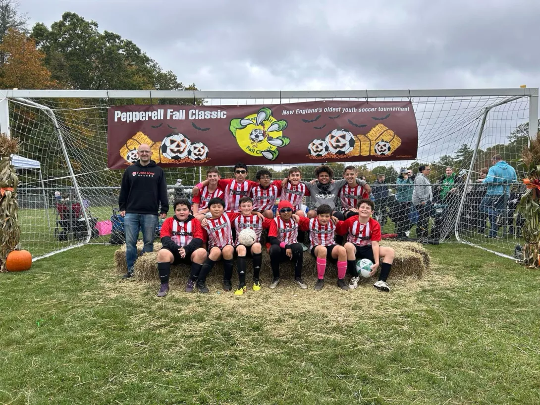 Tyngsboro team posing in front of goal during Pepperell Fall Classic tournament